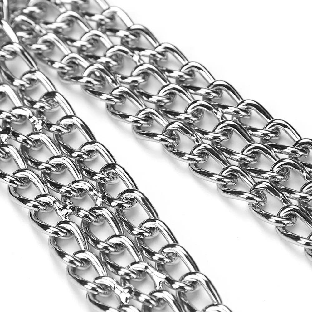 A close-up of a shiny silver metal chain with large interlocking links, metal collar for dogs 