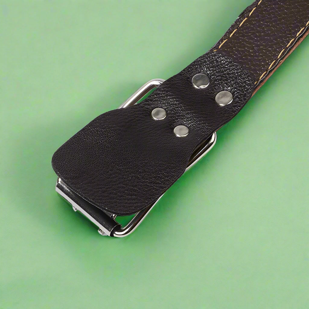 Close-up of a leather belt with metal buckle