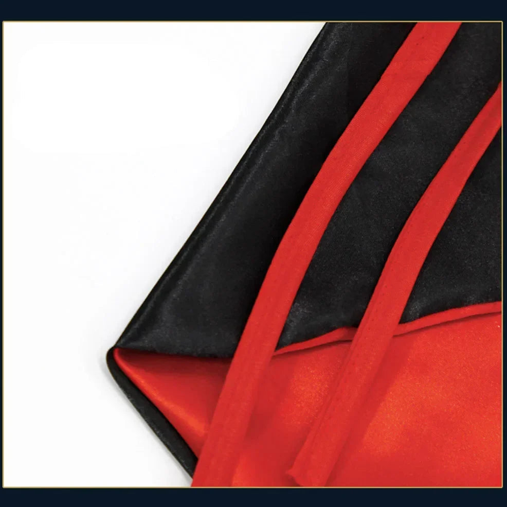 Close up of red and black pet cape spooky outfit