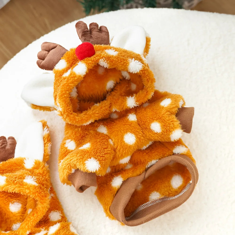 Fluffy reindeer-themed dog sweater on a white surface