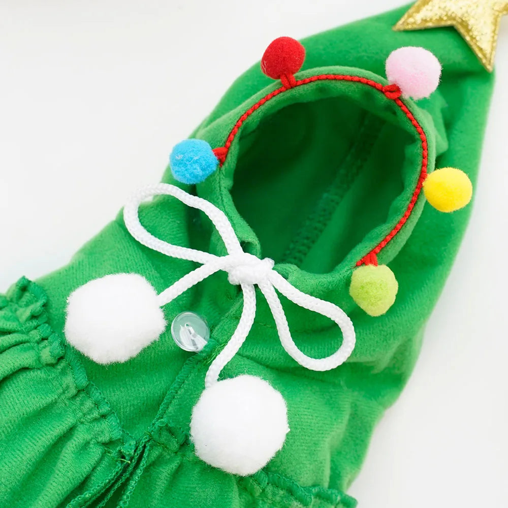 Green pet dog romper with colorful pom-poms.