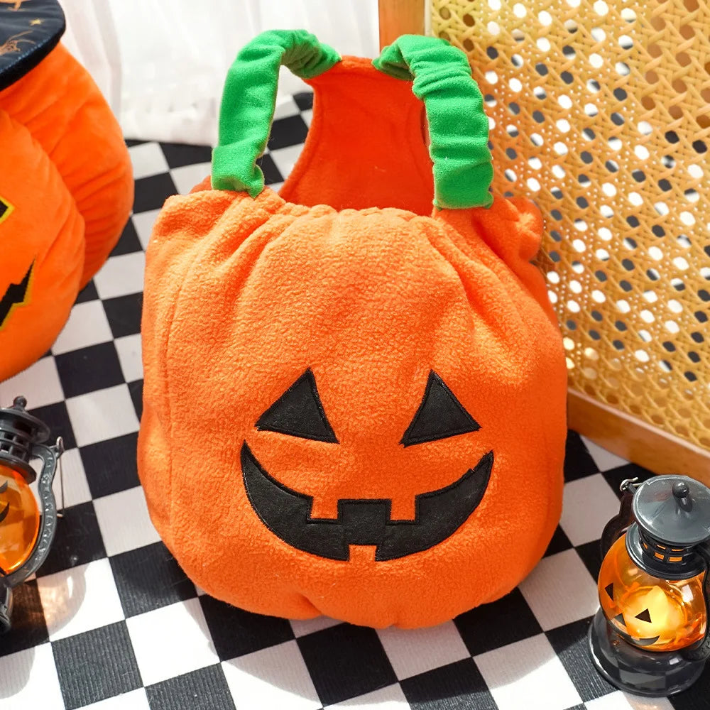 Orange pumpkin-shaped dog costume with a face with Halloween decorations.