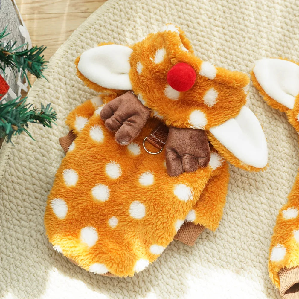 Plush reindeer dog outfit with polka dot pattern on a textured surface