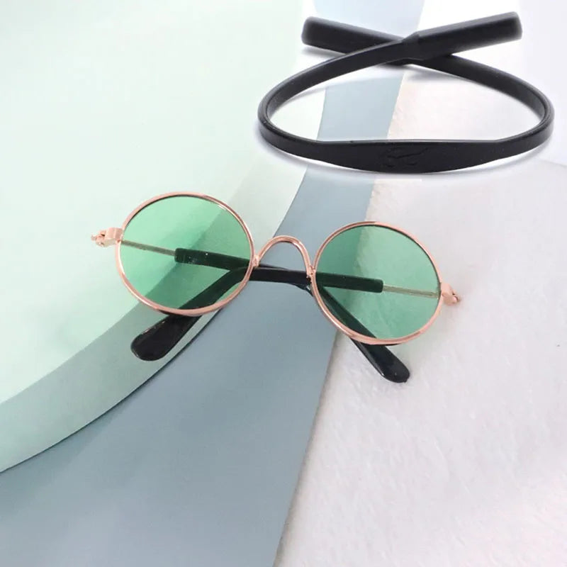 Round sunglasses with green lenses and rose gold frames for pets