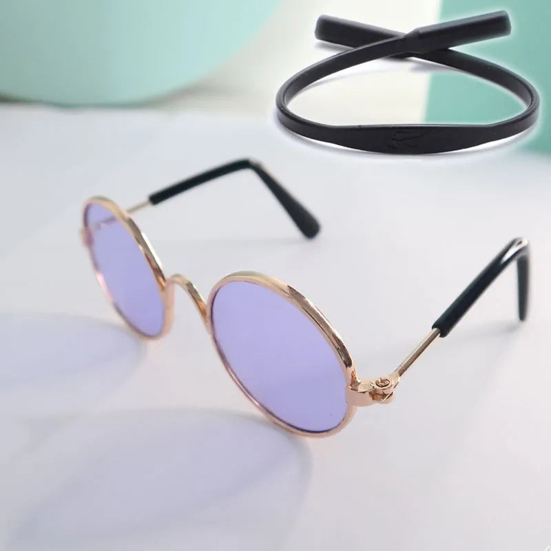 Sunglasses with purple lenses and gold frames for cats and dogs