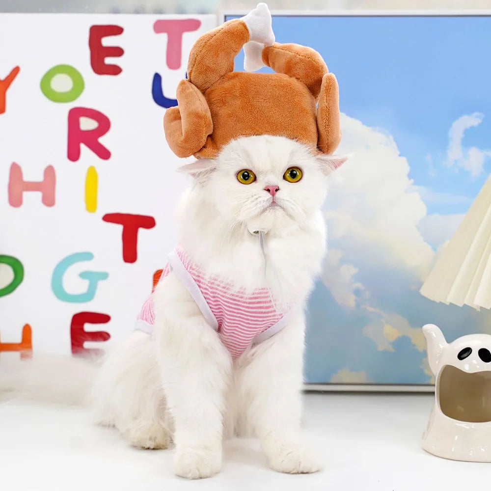 White cat wearing a brown chicken hat 