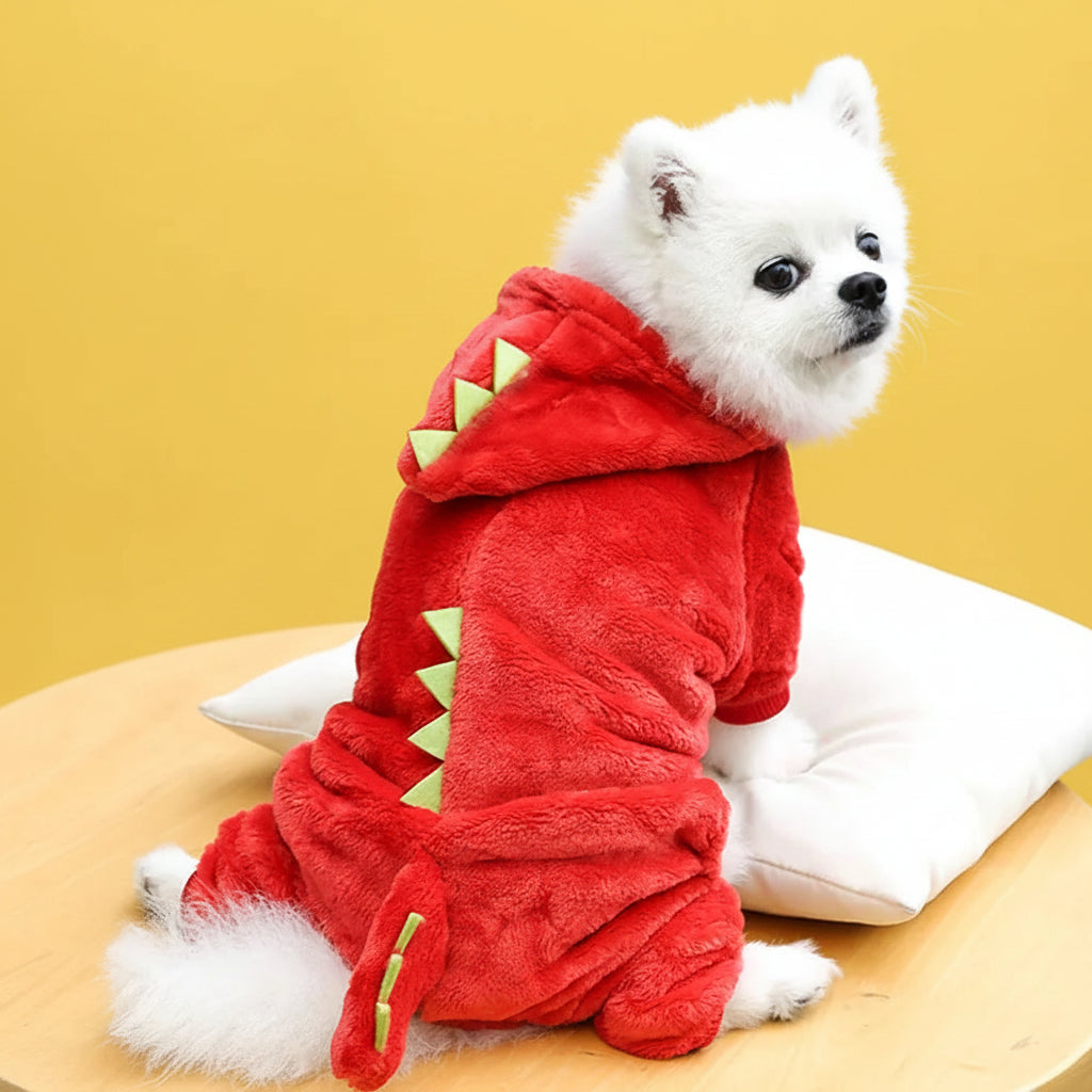 White dog wearing a red dragon costume pet outfit