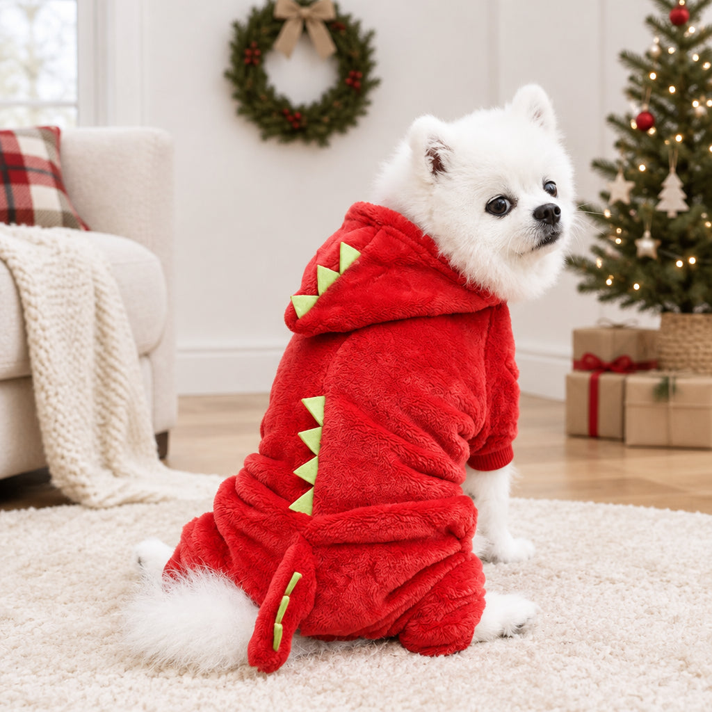 White dog wearing a red dragon costume pet outfit